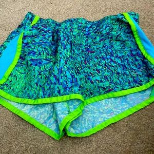 This pair of multi colored Champion shorts is in a size medium.